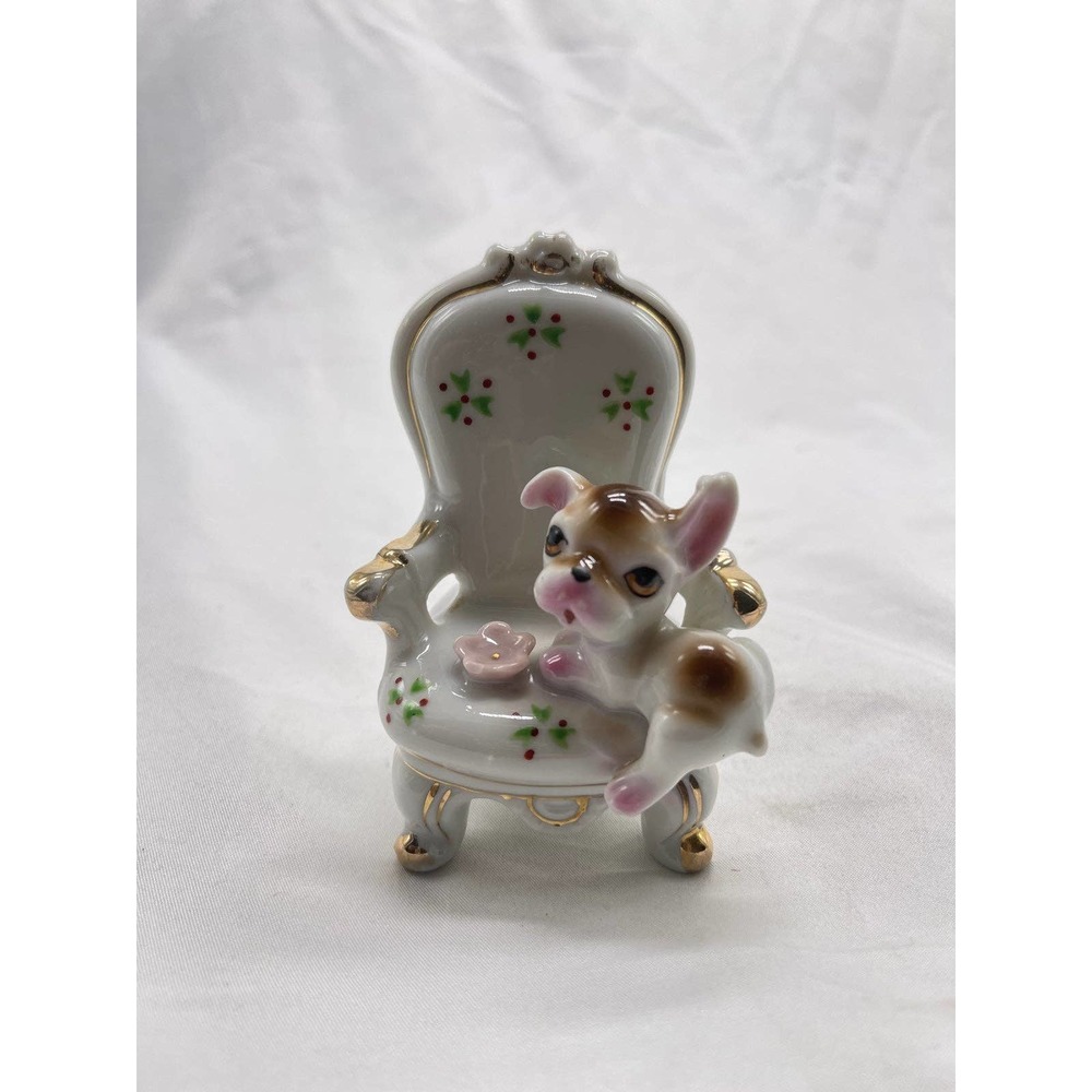 Vintage porcelain puppy on chair figurine